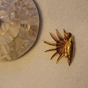 Metropolitan Museum of Art sea themed gold colored pin and/or pendant